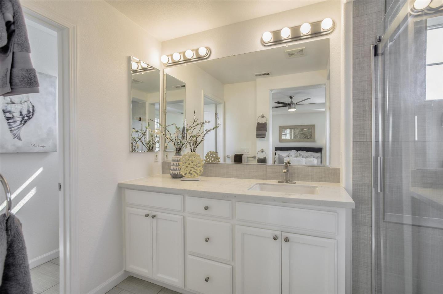 4203 Tobin Circle Santa Clara, CA 95054 - Photo 22 of 33 a bathroom with a sink vanity granite and a mirror