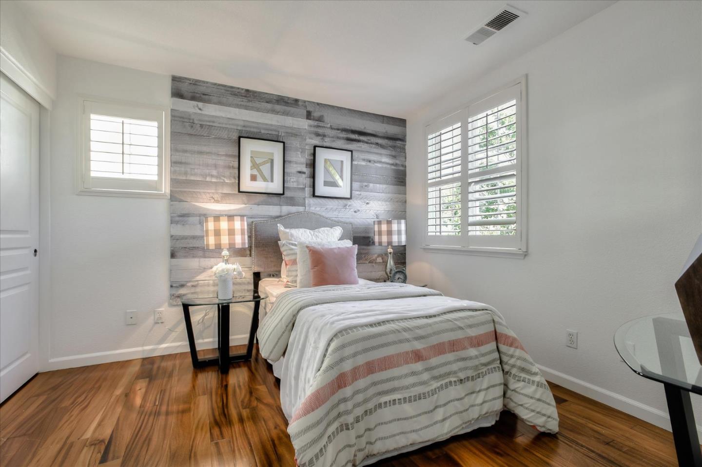 4203 Tobin Circle Santa Clara, CA 95054 - Photo 23 of 33 a bedroom with a bed and wooden floor