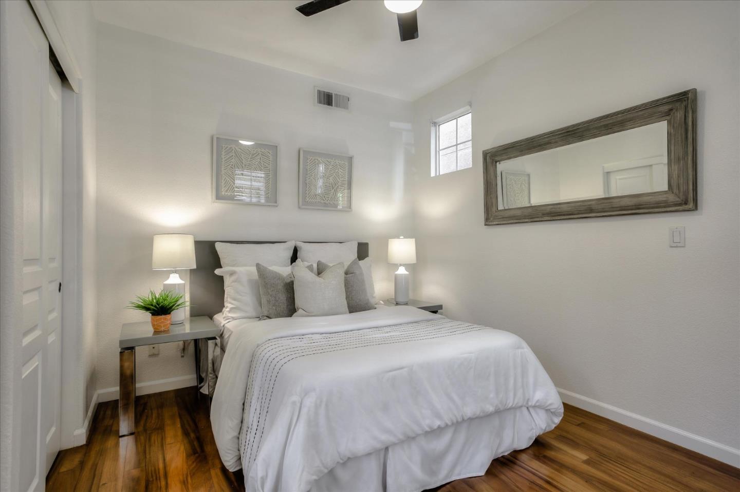 4203 Tobin Circle Santa Clara, CA 95054 - Photo 25 of 33 a bedroom with a bed and wooden floor