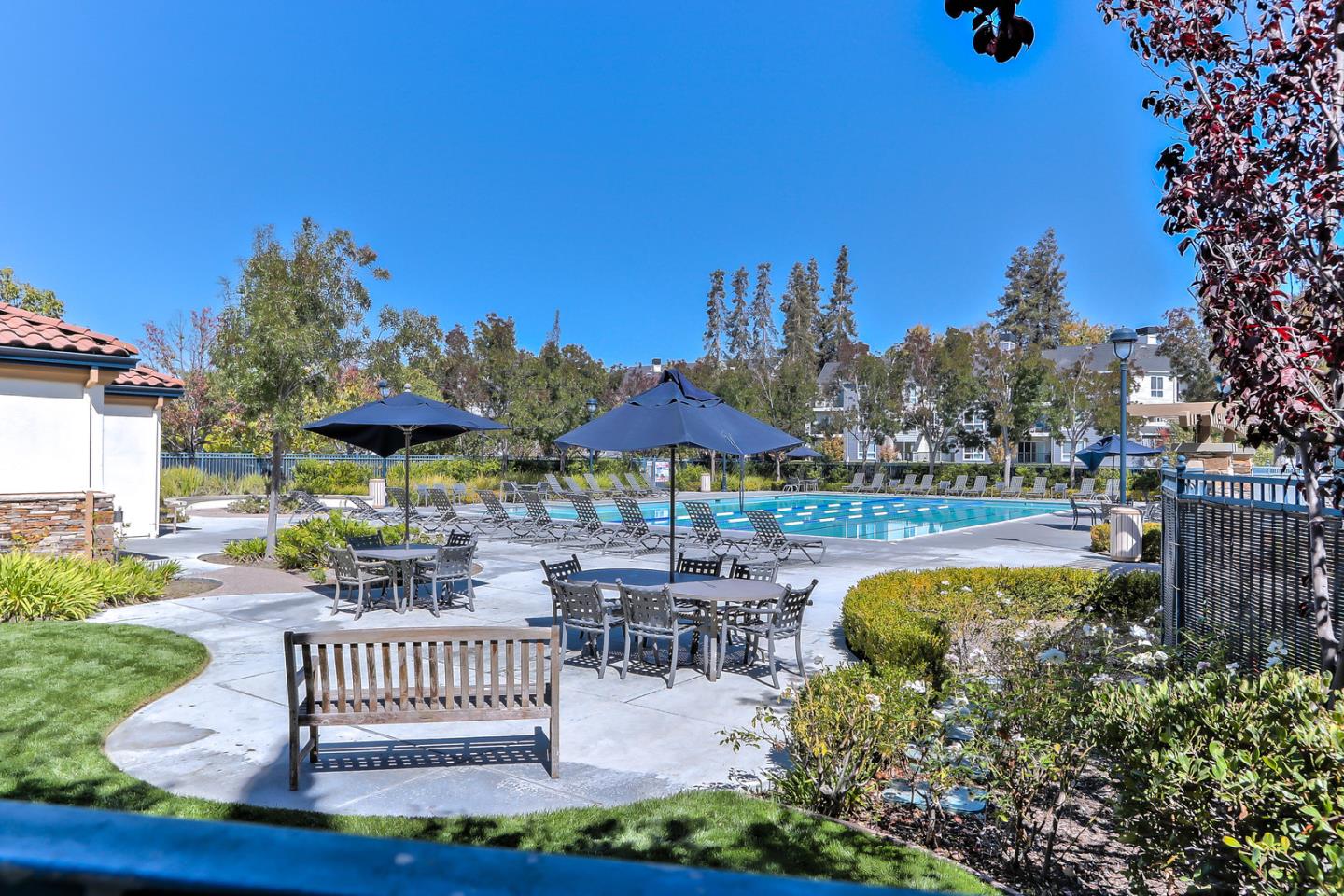 4203 Tobin Circle Santa Clara, CA 95054 - Photo 31 of 33 a view of a patio with a table chairs and a fire pit