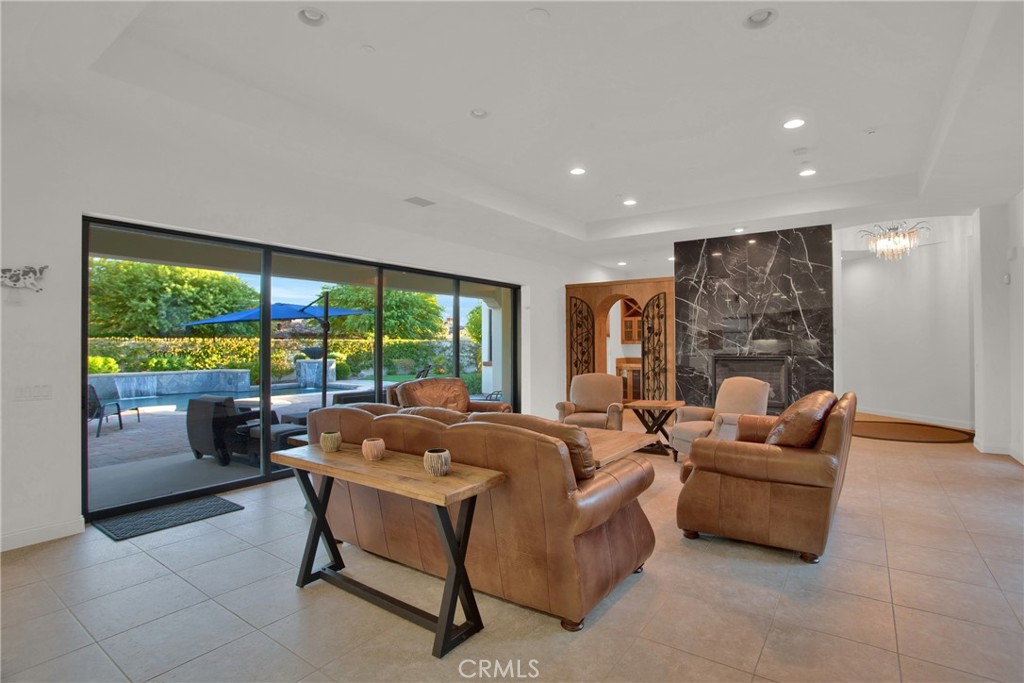 6 Cassis Circle Rancho Mirage, CA 92270 - Photo 25 of 74 a living room with furniture and a large window