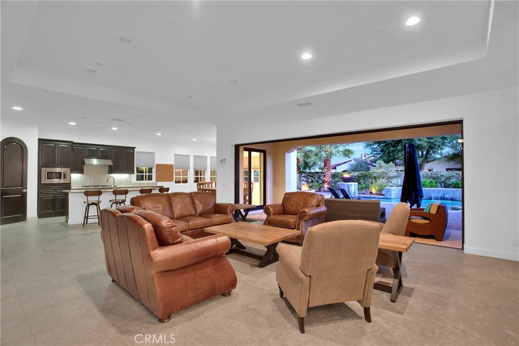 6 Cassis Circle Rancho Mirage, CA 92270 - Photo 27 of 74 a living room with furniture and a large window