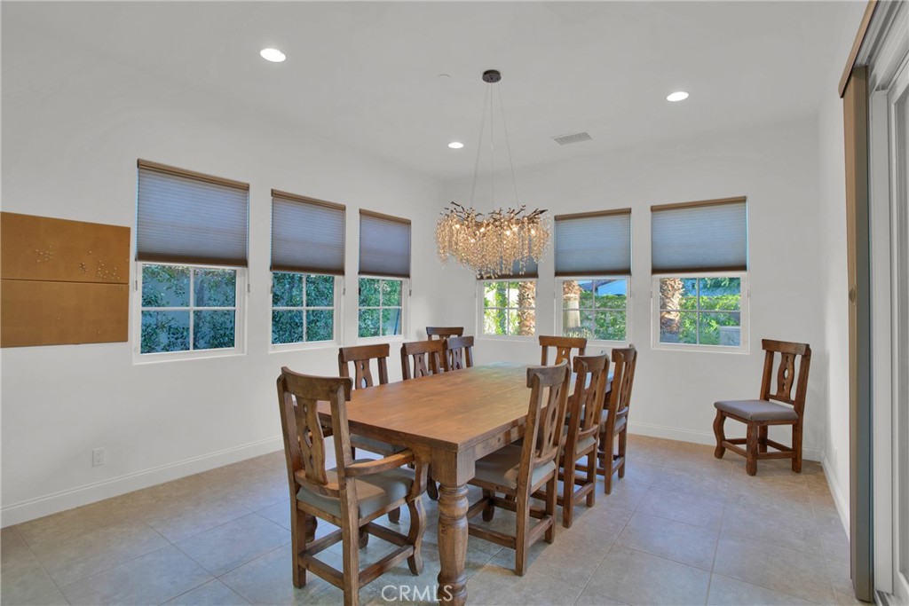 6 Cassis Circle Rancho Mirage, CA 92270 - Photo 33 of 74 a view of a dining room with furniture window and outside view