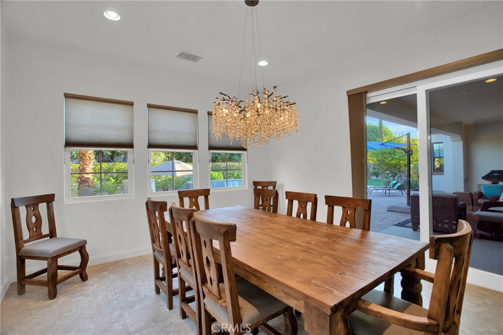6 Cassis Circle Rancho Mirage, CA 92270 - Photo 34 of 74 a view of a dining room with furniture window and outside view
