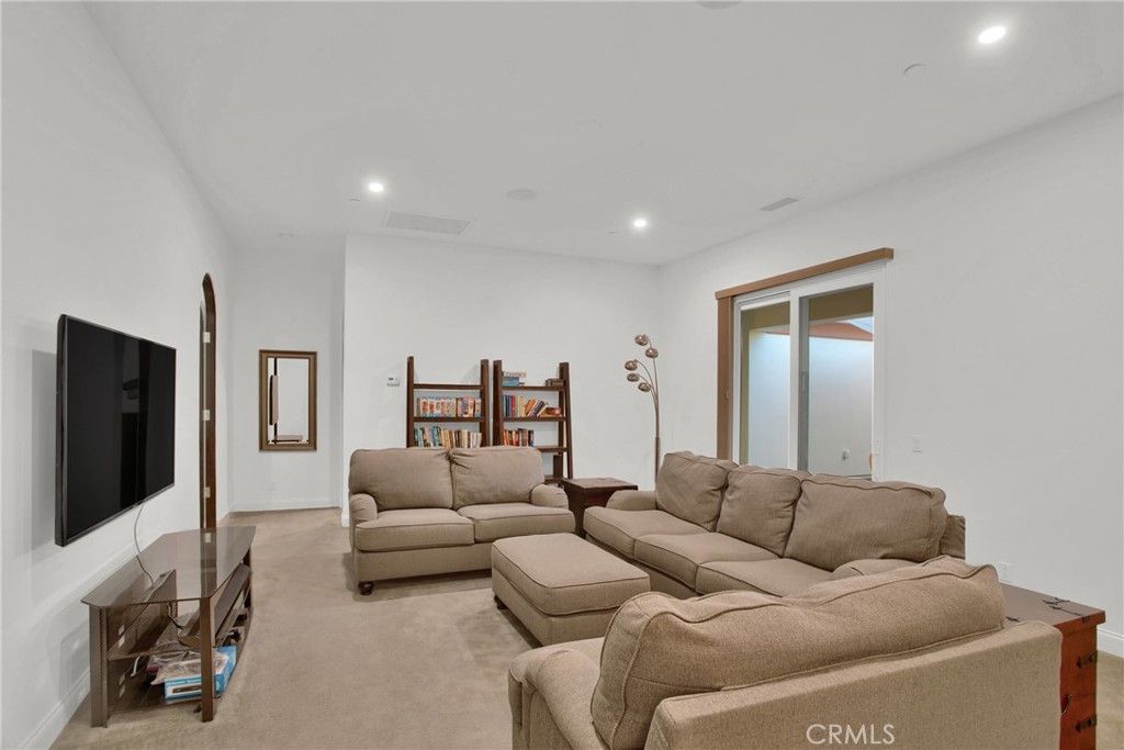 6 Cassis Circle Rancho Mirage, CA 92270 - Photo 38 of 74 a living room with furniture and a flat screen tv
