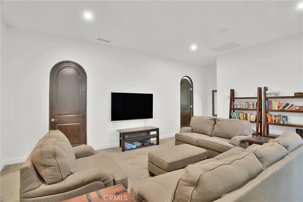 6 Cassis Circle Rancho Mirage, CA 92270 - Photo 39 of 74 a living room with furniture and a flat screen tv