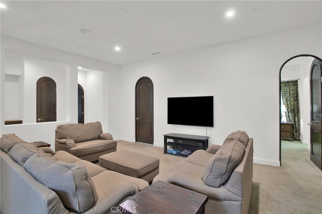 6 Cassis Circle Rancho Mirage, CA 92270 - Photo 40 of 74 a living room with furniture and a flat screen tv