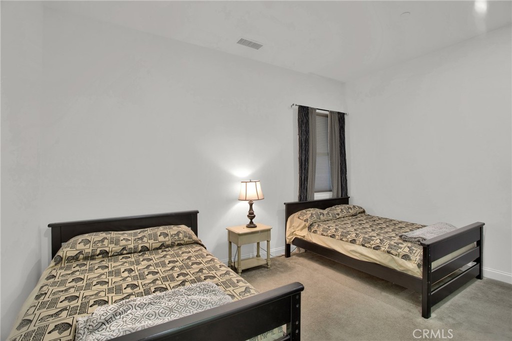 6 Cassis Circle Rancho Mirage, CA 92270 - Photo 43 of 74 a bedroom with a bed and window