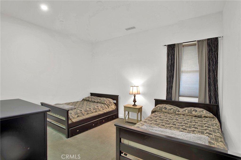 6 Cassis Circle Rancho Mirage, CA 92270 - Photo 44 of 74 a bedroom with a bed and a dresser