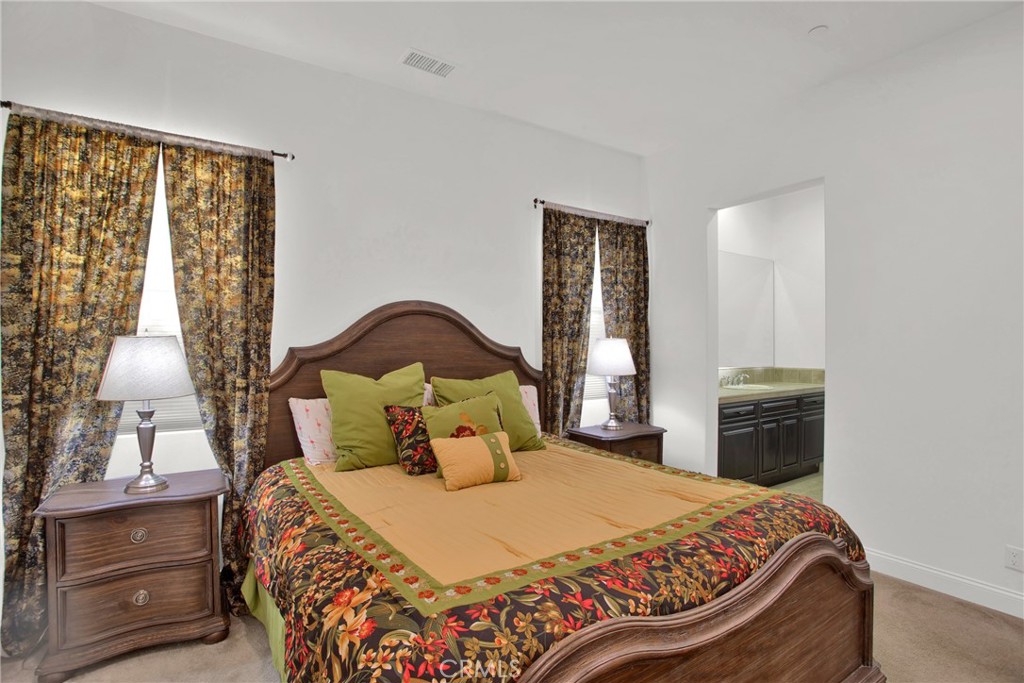 6 Cassis Circle Rancho Mirage, CA 92270 - Photo 46 of 74 a bedroom with a bed and a window