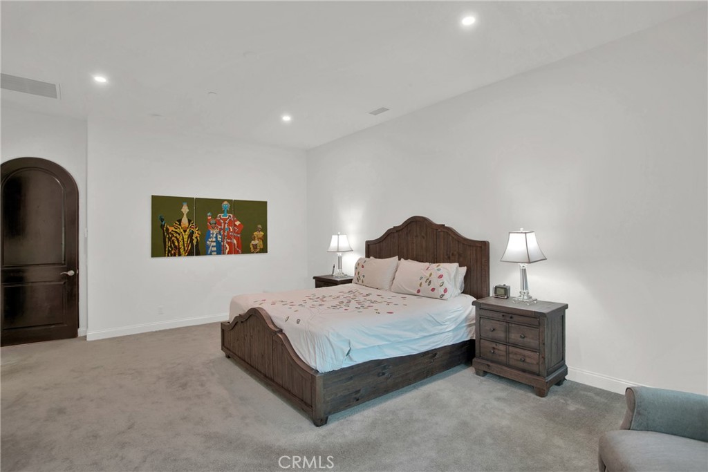 6 Cassis Circle Rancho Mirage, CA 92270 - Photo 51 of 74 a bedroom with a bed and a couch