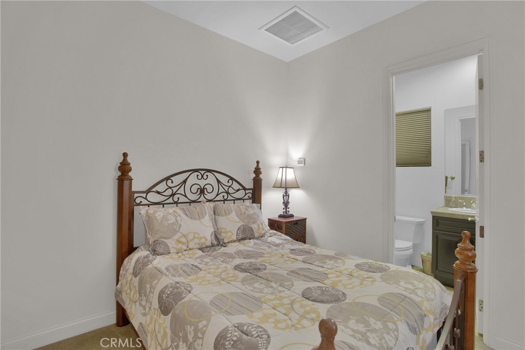 6 Cassis Circle Rancho Mirage, CA 92270 - Photo 55 of 74 a bedroom with a bed and a stove