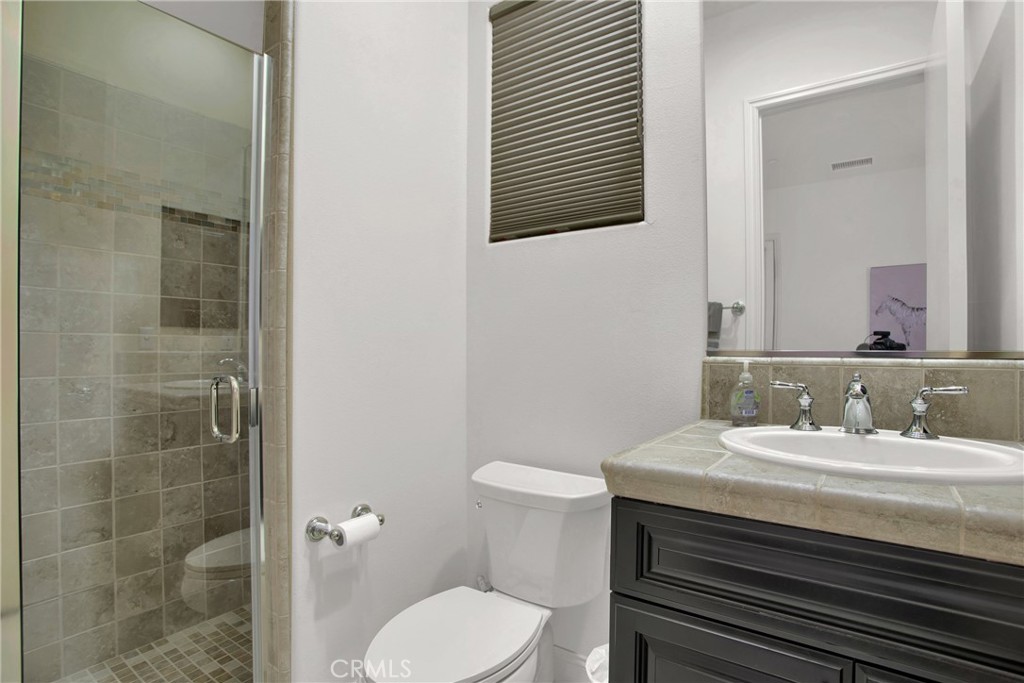 6 Cassis Circle Rancho Mirage, CA 92270 - Photo 56 of 74 a bathroom with a sink toilet and shower