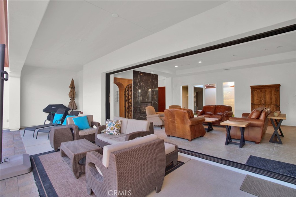 6 Cassis Circle Rancho Mirage, CA 92270 - Photo 58 of 74 a living room with furniture and a window