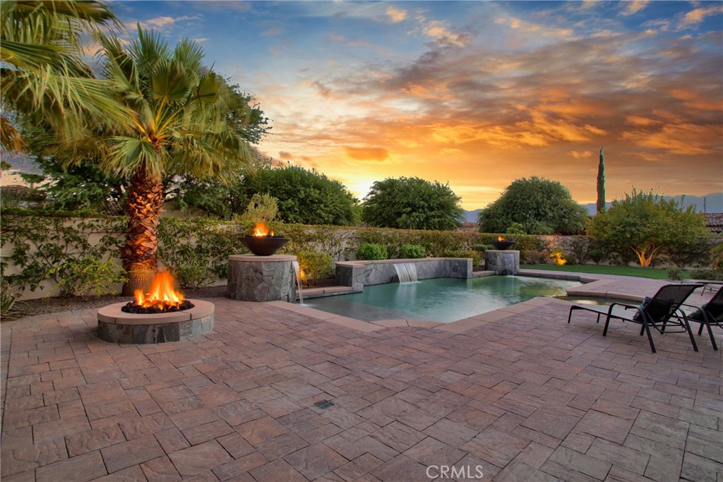 6 Cassis Circle Rancho Mirage, CA 92270 - Photo 69 of 74 a backyard of a house with table and chairs