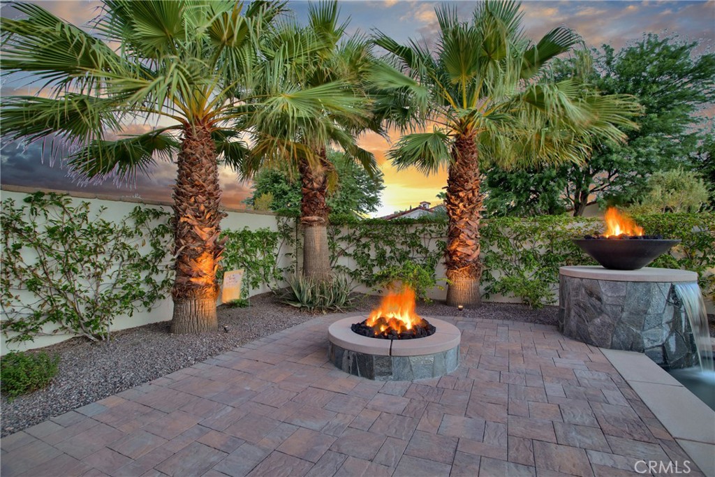 6 Cassis Circle Rancho Mirage, CA 92270 - Photo 70 of 74 a view of a backyard with of water fountain and fire pit