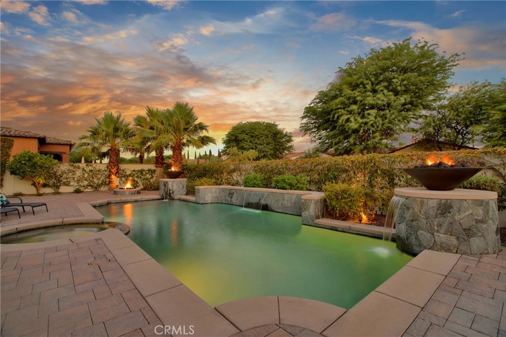 6 Cassis Circle Rancho Mirage, CA 92270 - Photo 73 of 74 a view of a lake with a building in the background