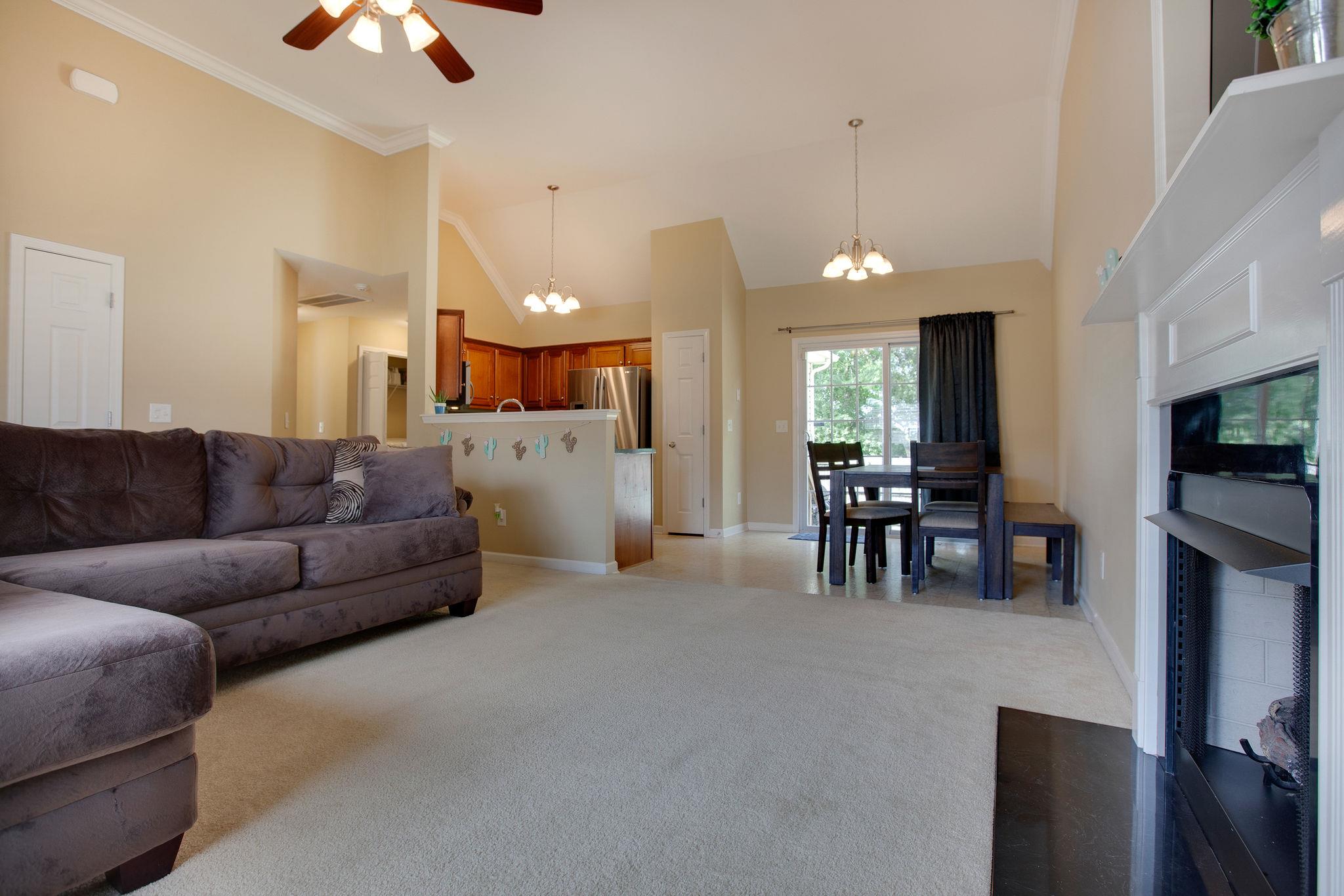 1046 Golf View Way Spring Hill, TN 37174 - Photo 8 of 22 a living room with furniture and a flat screen tv