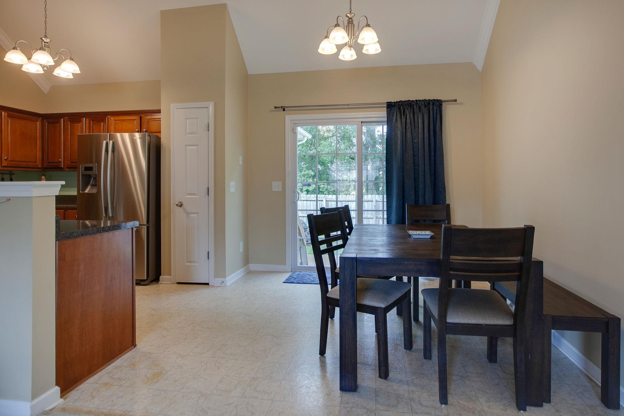 1046 Golf View Way Spring Hill, TN 37174 - Photo 10 of 22 a view of a dining room with furniture window and outside view
