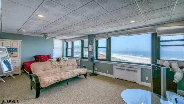 a bedroom with a bed and a balcony view