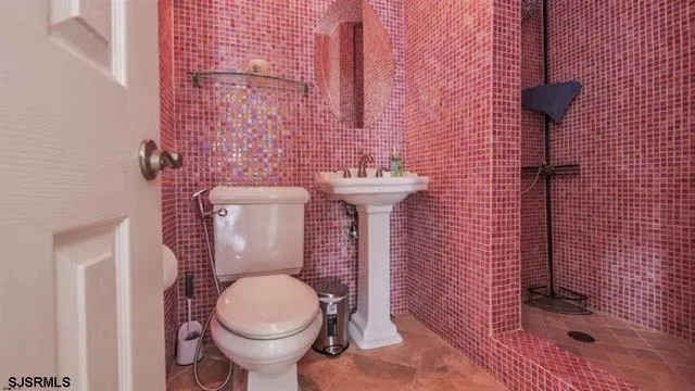 a bathroom with a toilet and a sink