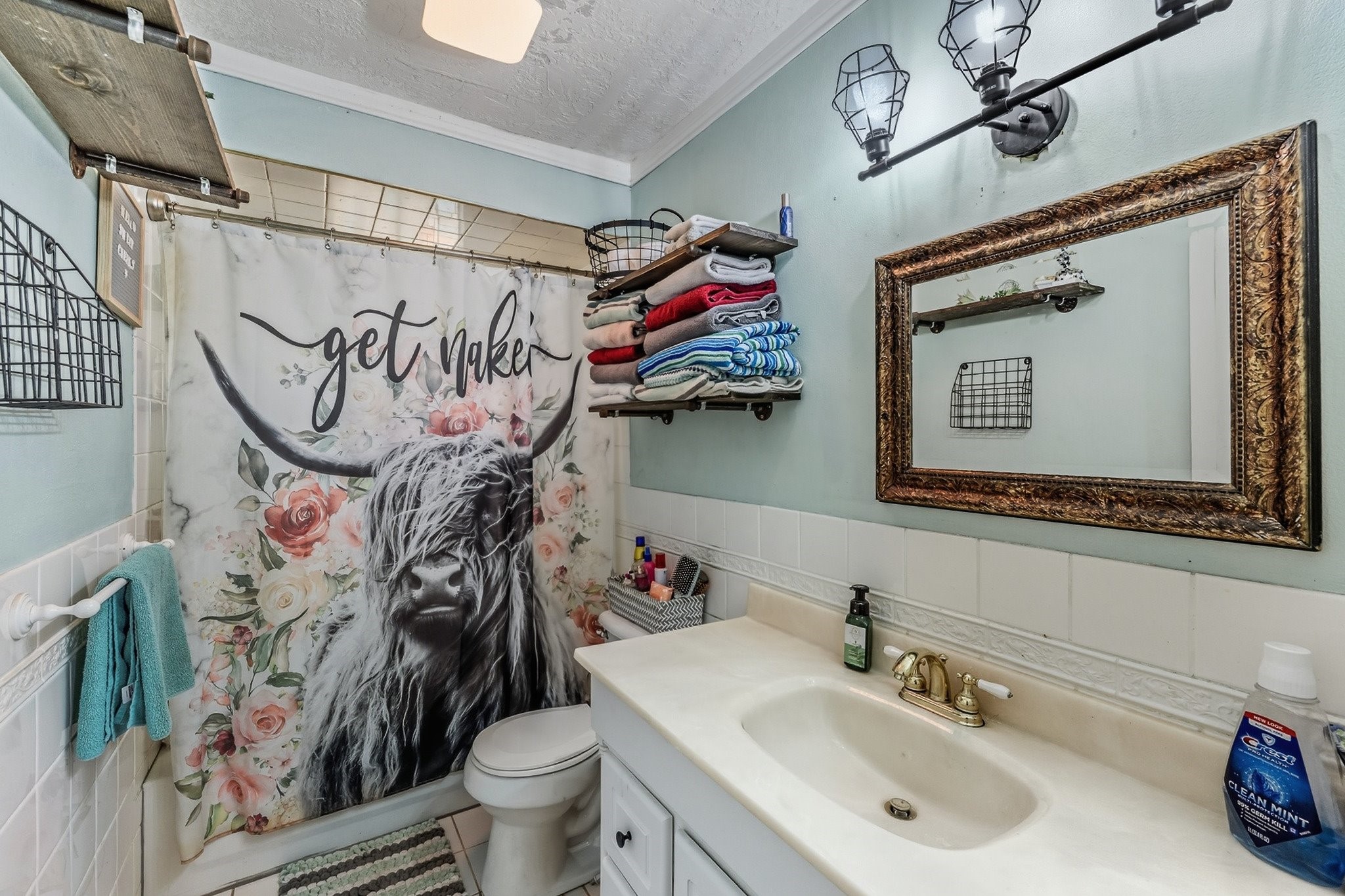 9523 West Fm 1644 Calvert, TX 77837 - Photo 12 of 22 a bathroom with a sink mirror vanity and toilet