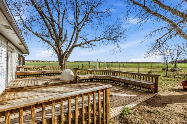 a view of a pathway with a wrought fence