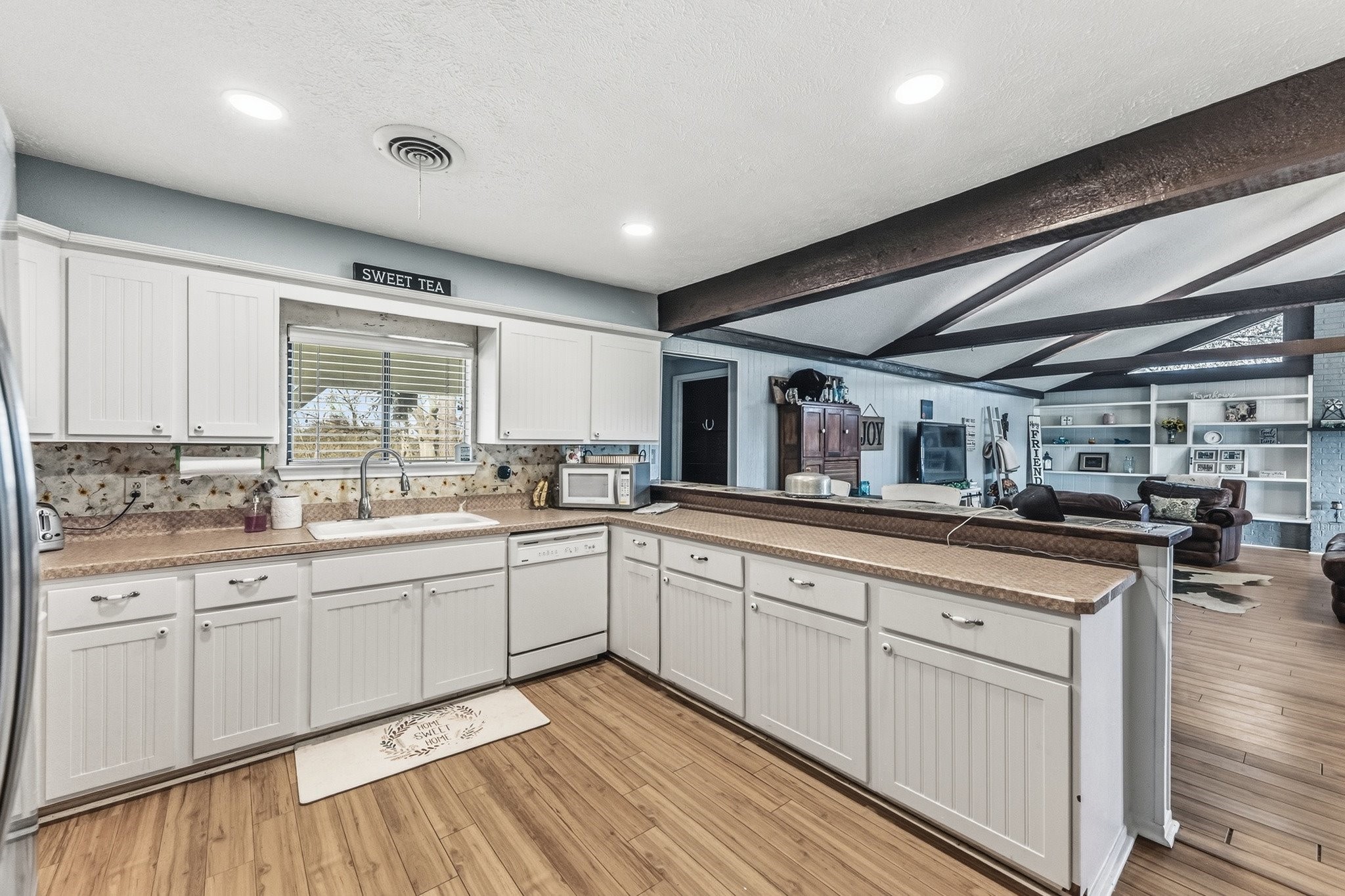 9523 West Fm 1644 Calvert, TX 77837 - Photo 6 of 22 a kitchen with white cabinets and sink