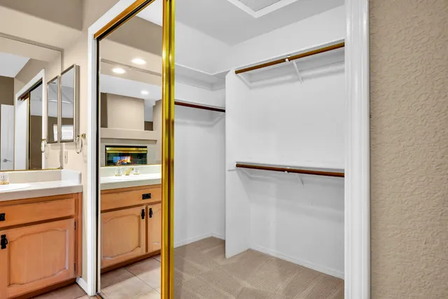 a view of walk in closet with window