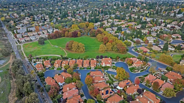 an aerial view of a golf course with outdoor space