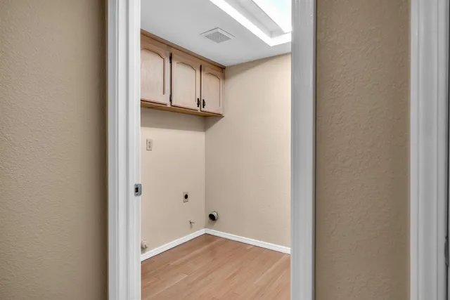 a view of a kitchen with wooden floor
