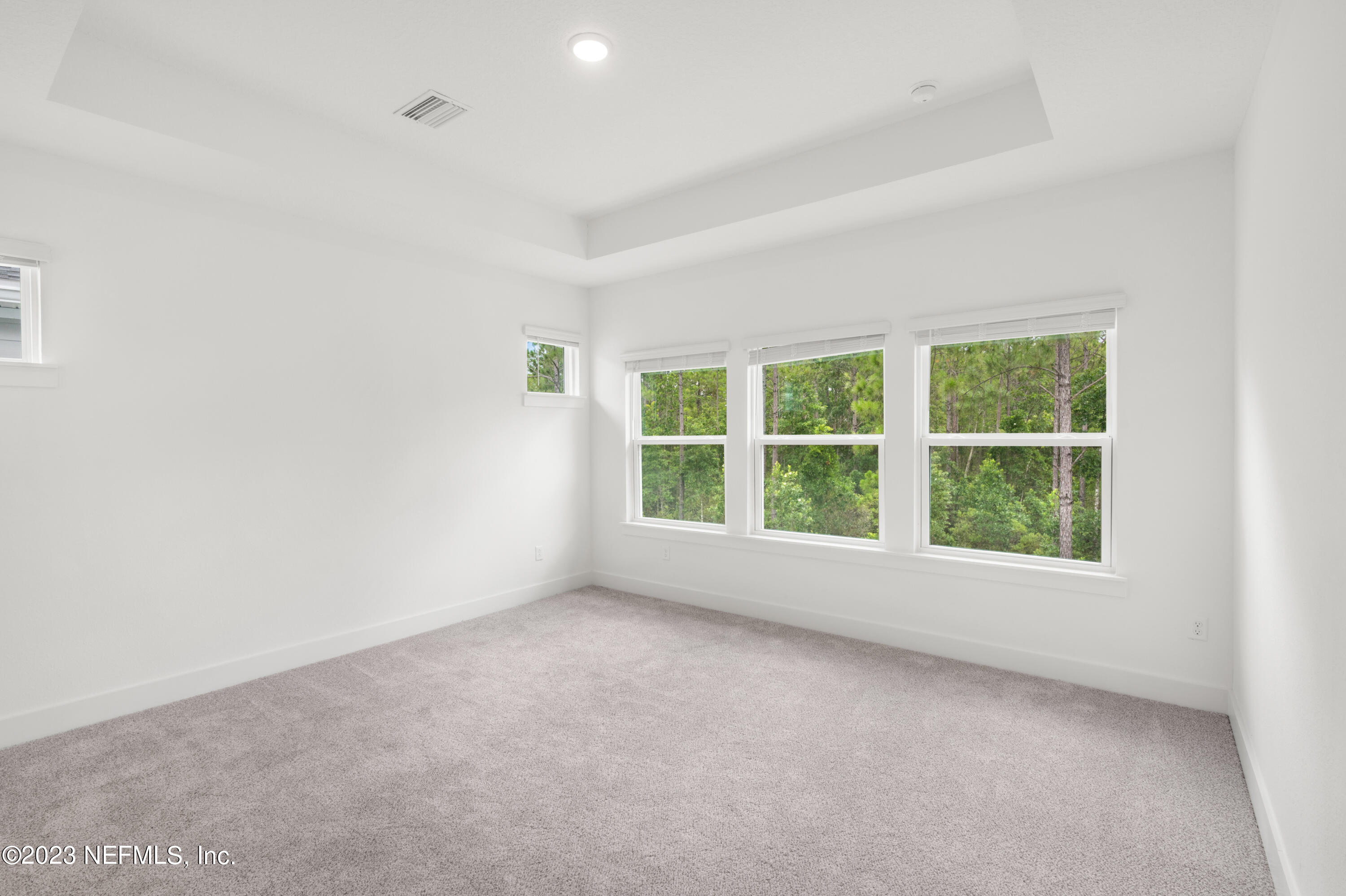 9993 Element Road Jacksonville, FL 32256 - Photo 8 of 11 an empty room with a window