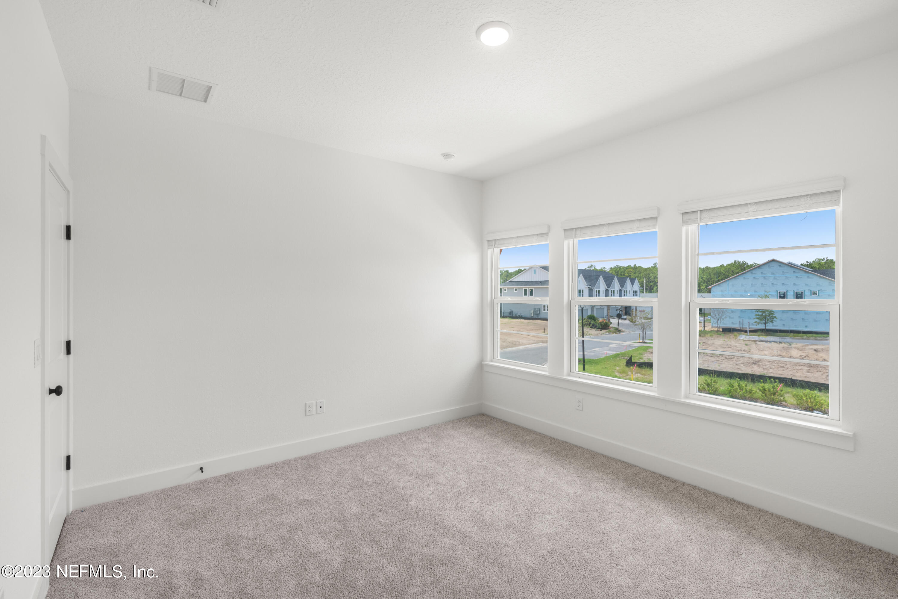 9993 Element Road Jacksonville, FL 32256 - Photo 10 of 11 an empty room with windows