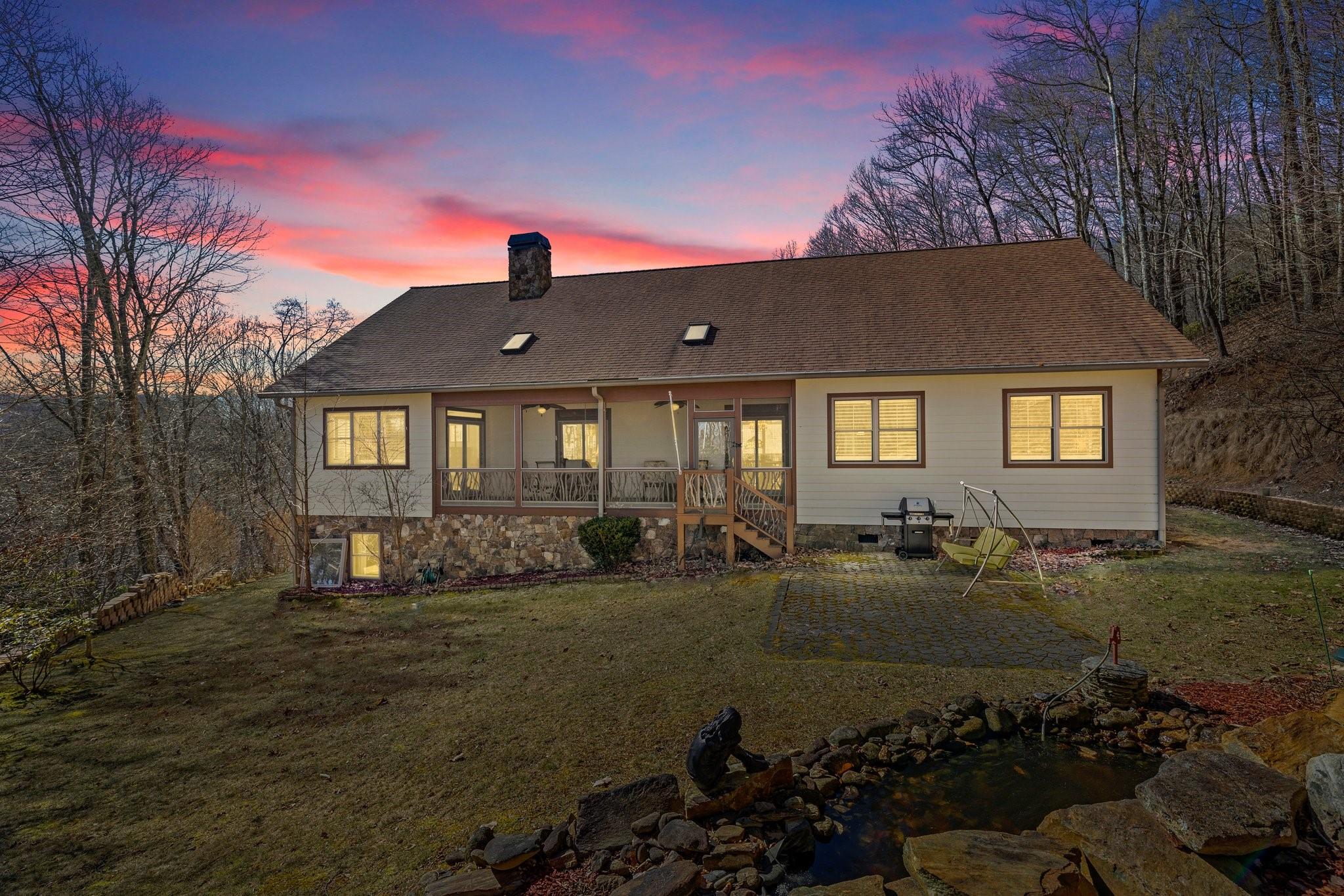 400 The High Road Waynesville, NC 28786 - Photo 7 of 36 a front view of a house with a yard