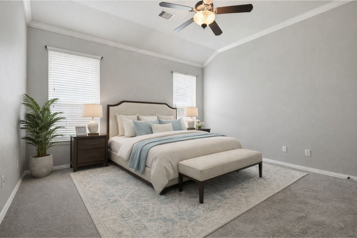 7 Maple Mill Court Conroe, TX 77301 - Photo 11 of 20 a bedroom with a bed and ceiling fan
