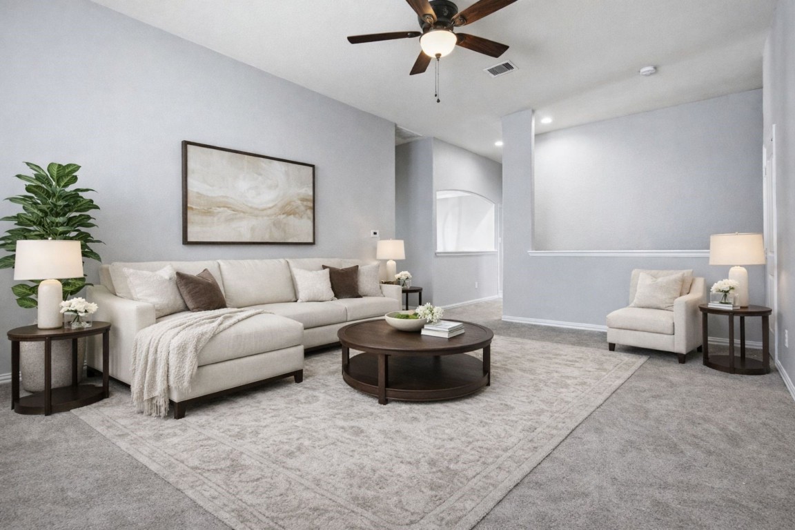 7 Maple Mill Court Conroe, TX 77301 - Photo 15 of 20 a living room with furniture and a potted plant