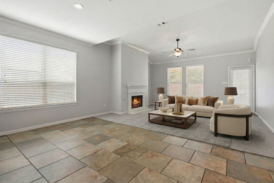7 Maple Mill Court Conroe, TX 77301 - Photo 4 of 20 a living room with furniture and a fireplace