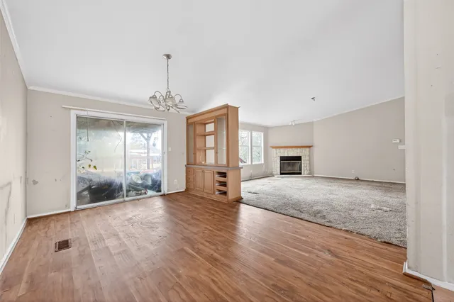 a large kitchen with cabinets and stainless steel appliances