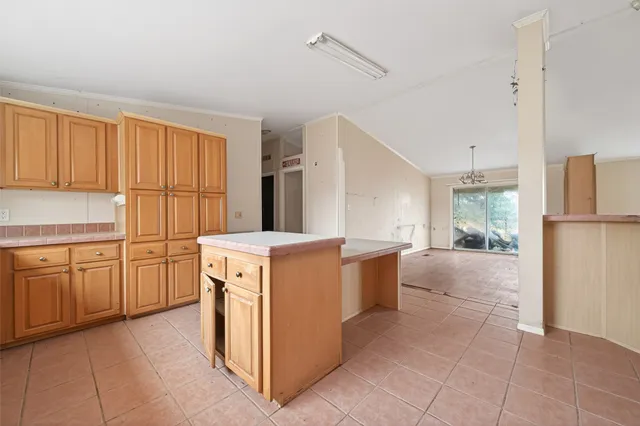 a kitchen with a stove a sink and a refrigerator