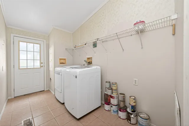 a bathroom with a double vanity sink a mirror a bathtub and shower