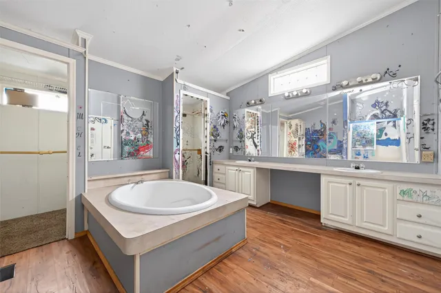 a spacious bathroom with a tub and shower