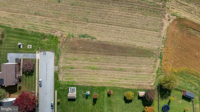 a view of a big yard with an outdoor seating