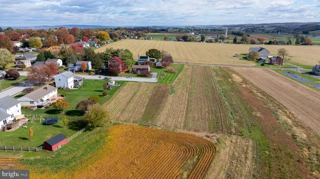 a view of a swimming pool with an outdoor seating