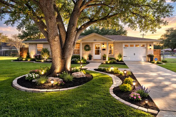 a view of a house with swimming pool and a yard