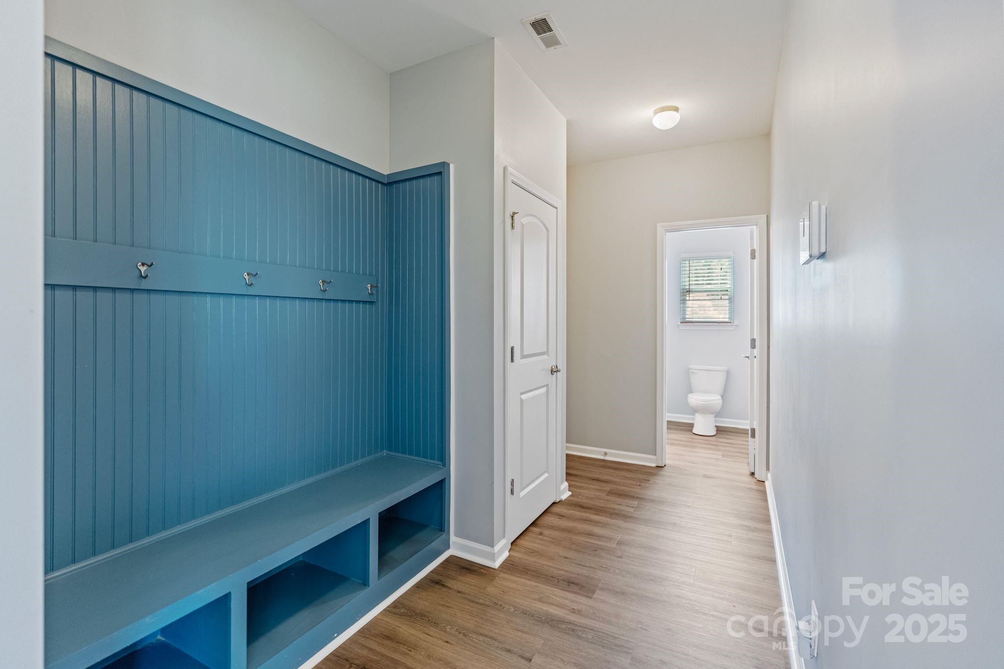 7129 Dove Field Lane Fort Mill, SC 29707 - Photo 19 of 27 a view of a hallway with wooden floor