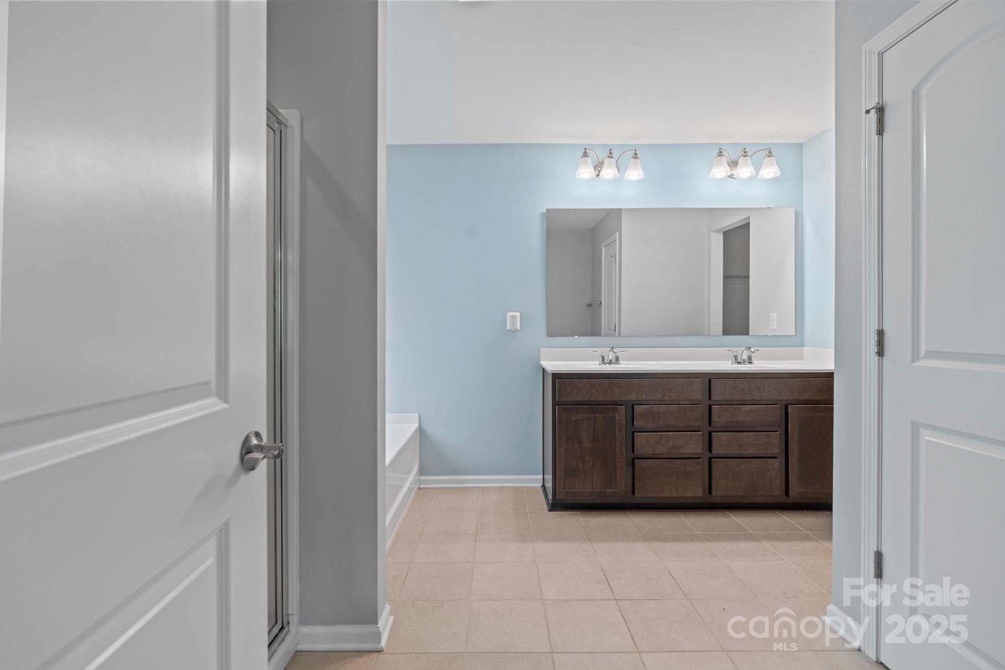 7129 Dove Field Lane Fort Mill, SC 29707 - Photo 22 of 27 a bathroom with a double vanity sink and a mirror