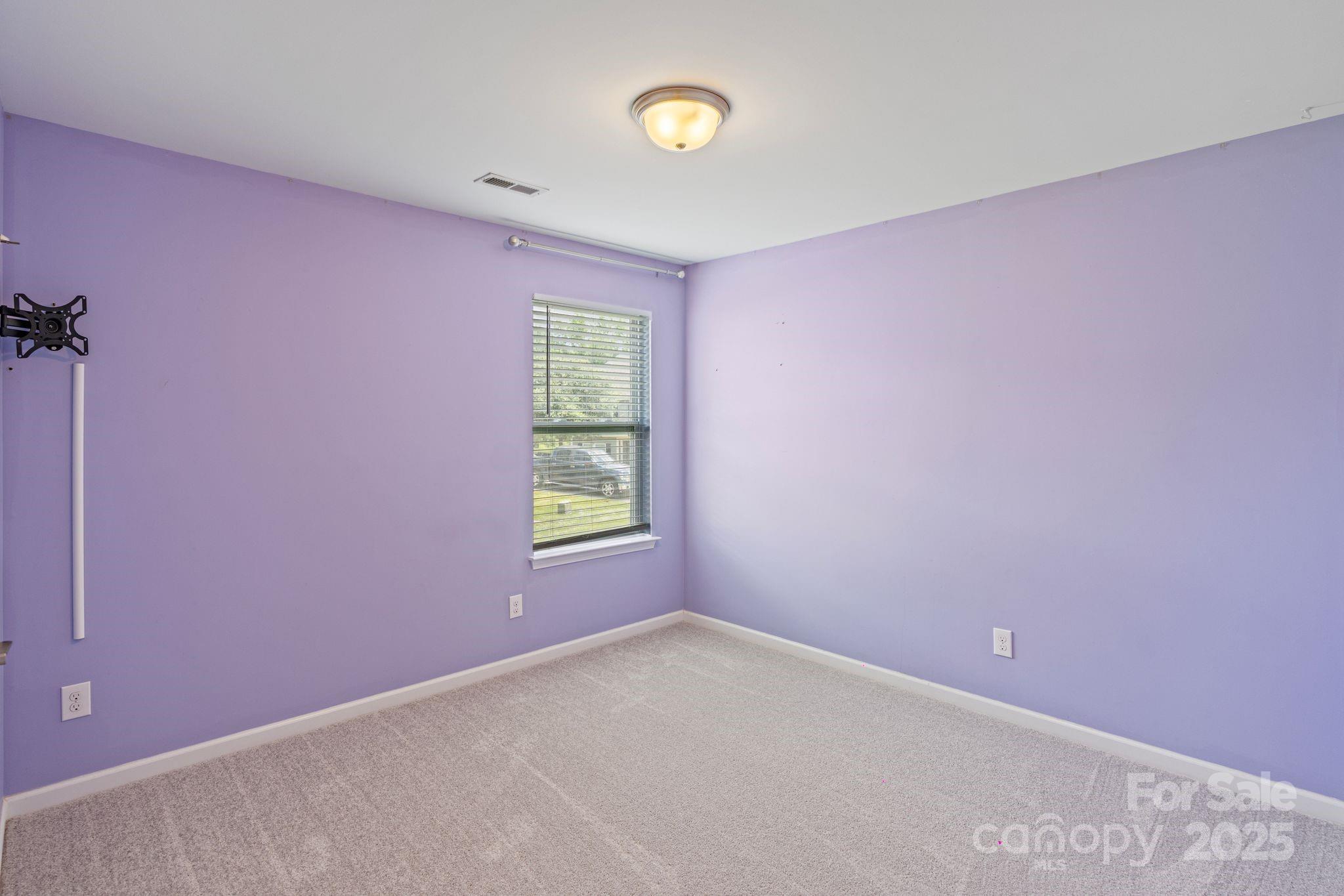 7129 Dove Field Lane Fort Mill, SC 29707 - Photo 23 of 27 an empty room with windows and closet