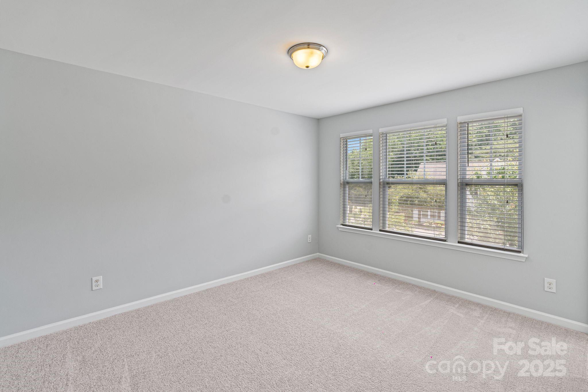 7129 Dove Field Lane Fort Mill, SC 29707 - Photo 24 of 27 an empty room with windows