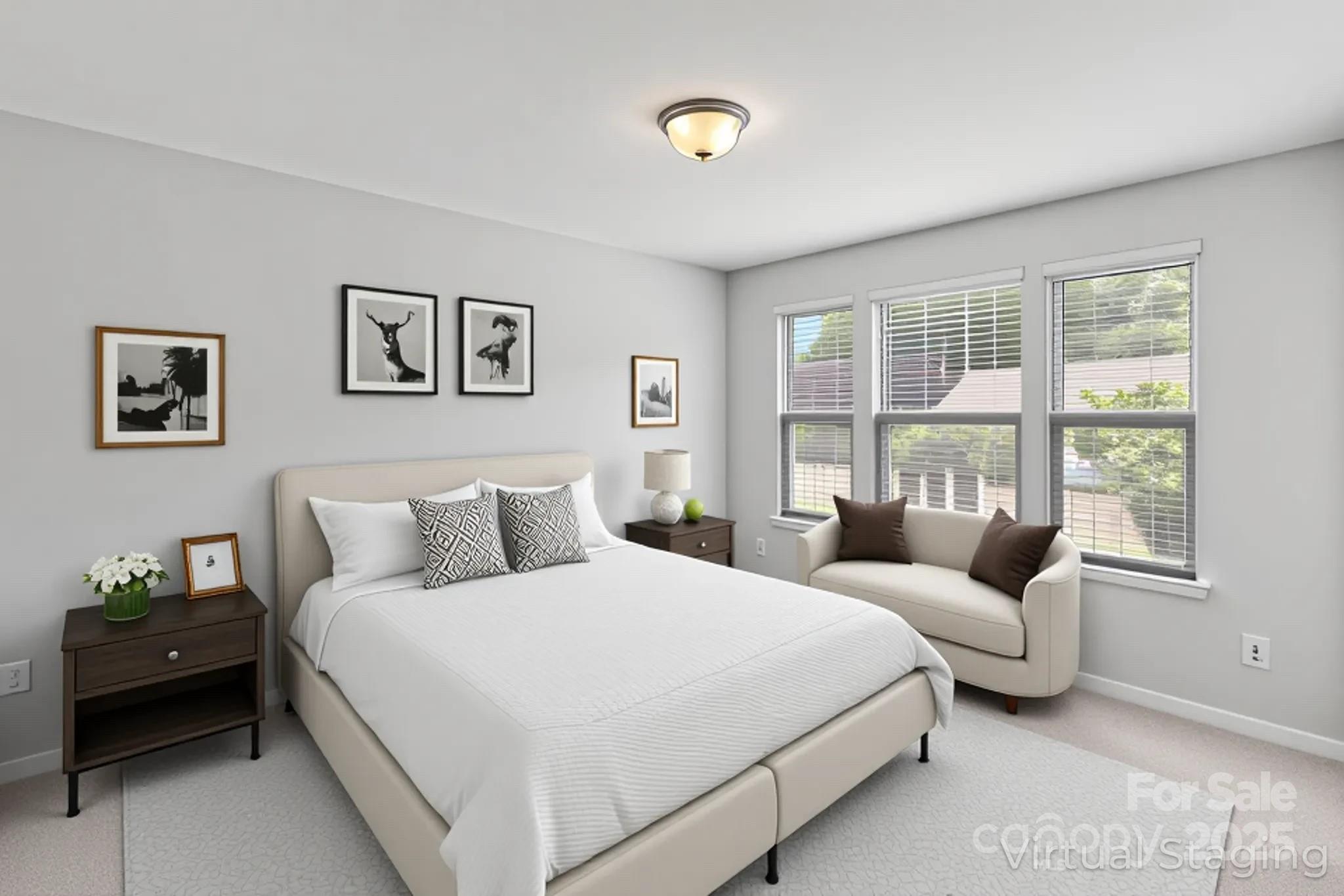 7129 Dove Field Lane Fort Mill, SC 29707 - Photo 7 of 27 a bedroom with a bed and a large window