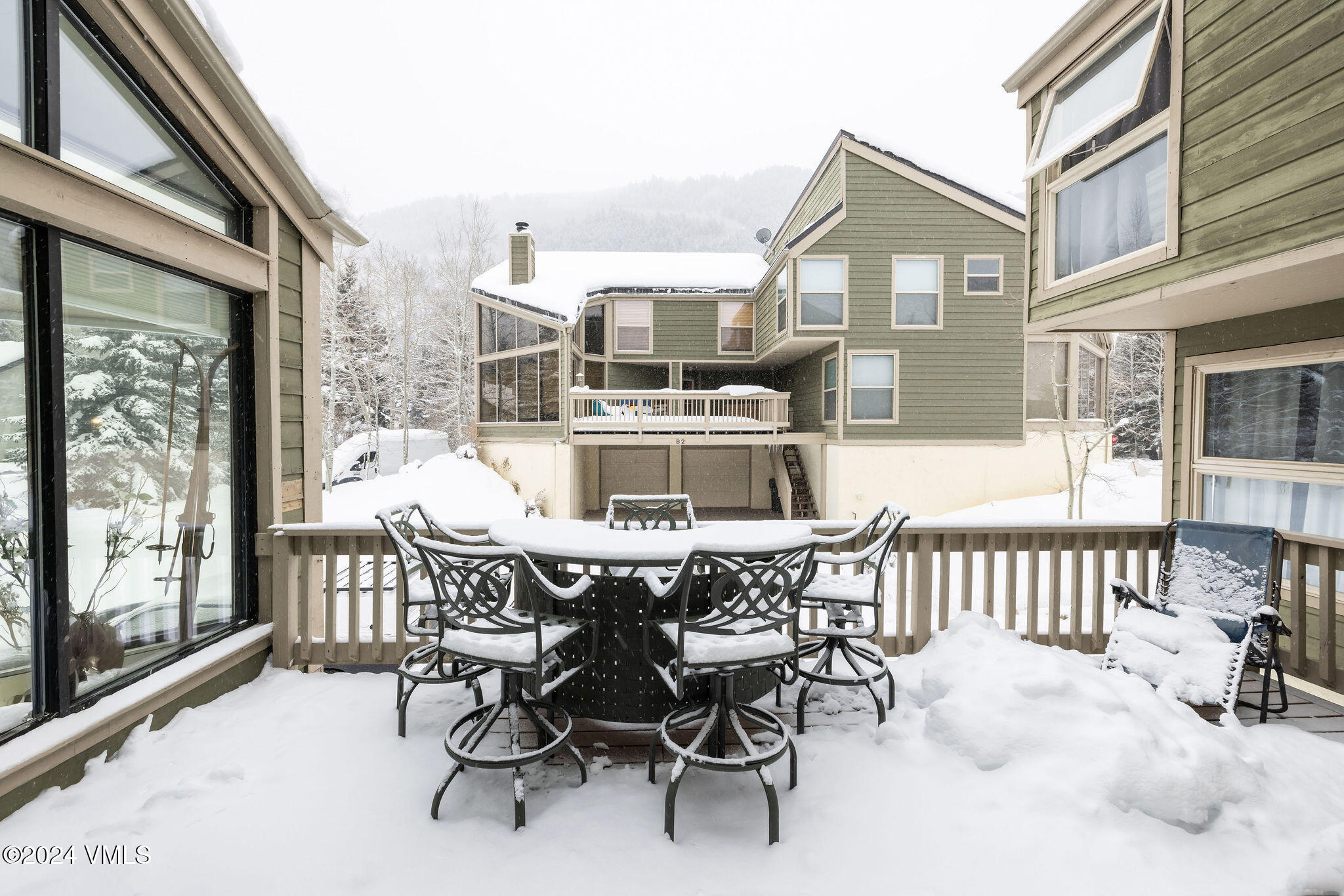 16 Eagle-Vail Road, Unit A3 Eagle-Vail, CO 81620 - Photo 16 of 24 a view of a dining room with furniture and a porch